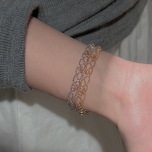 Elegant S925 sterling silver and rose gold beaded lace bracelets on a woman's wrist