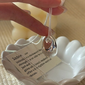 Minimalist S925 silver hollow teardrop pendant necklace with a polished mirror finish
