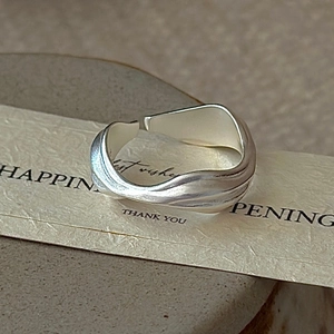 Minimalist S925 sterling silver wavy ring with adjustable open design and matte texture