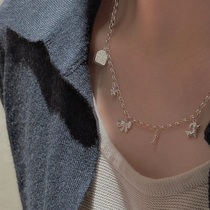 S925 sterling silver necklace featuring cute house, flower, bow, bone and dog charms