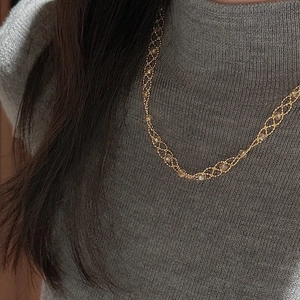 S925 silver lace chain necklace in gold with delicate beads on grey sweater