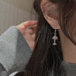 Minimalist S925 sterling silver desk lamp shaped hook earrings worn by a model