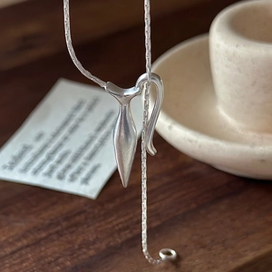 Minimalist S925 sterling silver necklace with matte geometric pendant on dark wood
