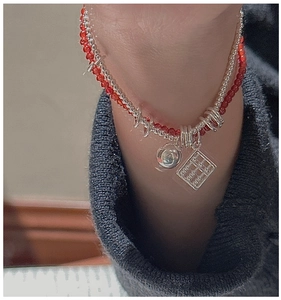 Detailed macro view of S925 silver abacus and red agate bead double-layer bracelet