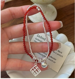 Close-up of S925 silver double-layer beaded bracelet with red agate and abacus charm