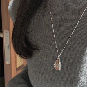 Elegant S925 sterling silver necklace featuring an irregular organic lava drop pendant