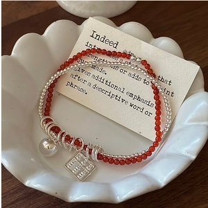 Detailed close-up of S925 silver abacus and red agate double-layer beaded bracelet