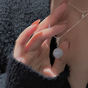 Close-up of S925 sterling silver necklace with a pale purple gemstone bead pendant