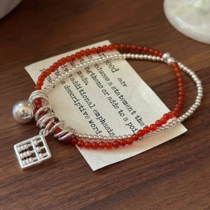 S925 silver beaded bracelet with red agate beads and a vintage abacus pendant