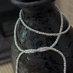 Minimalist S925 sterling silver rope chain necklace displayed on a ceramic vase
