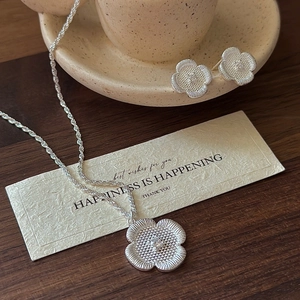 S925 sterling silver floral necklace and earrings set with brushed petals and center crystals