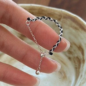 Adjustable S925 sterling silver chain ring with red cord and sliding bead detail