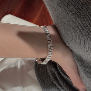 Close-up of elegant S925 sterling silver multi-layer bracelet with sparkling silver beads