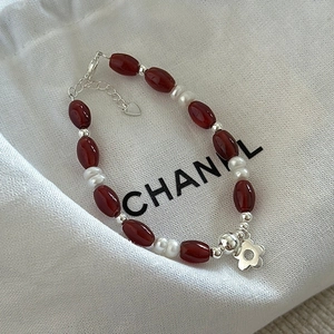 S925 sterling silver bracelet with red agate, white pearls and a floral pendant charm