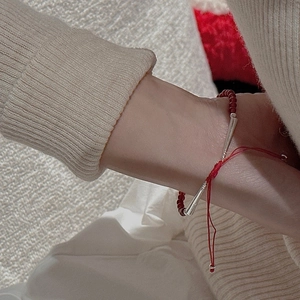 Close-up of minimalist S925 silver beaded red agate bracelet worn on woman's wrist