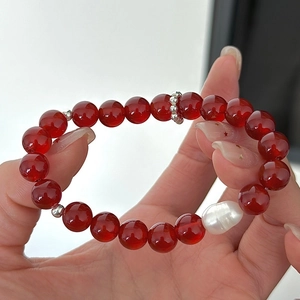 S925 silver red agate beaded bracelet with a baroque pearl, shown on hand