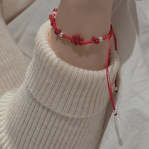 Adjustable red braided rope bracelet with S925 silver beads and red flower charms