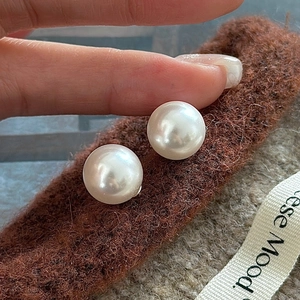 Classic round S925 sterling silver pearl stud earrings with a creamy white luster finish