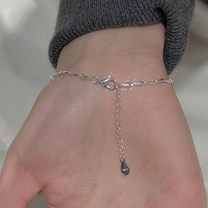 Minimalist S925 sterling silver chain bracelet with lobster clasp on a woman's wrist