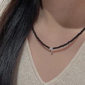 S925 sterling silver beaded choker necklace with metallic water drop pendant on a model