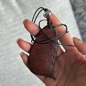 Handcrafted S925 silver and dark brown seed pod pendant necklace on a black braided cord