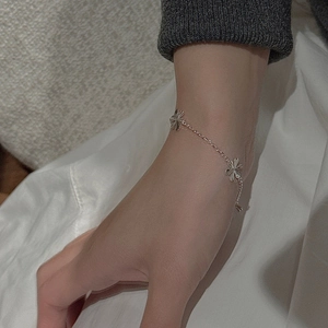 S925 sterling silver chain bracelet with CNC snowflake pendants on woman's wrist