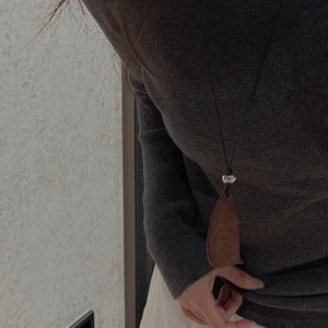 S925 sterling silver drop pendant necklace on a dark grey turtleneck sweater