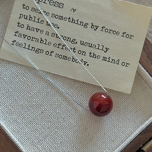 Minimalist S925 silver beaded necklace with round red agate pendant in a wooden box