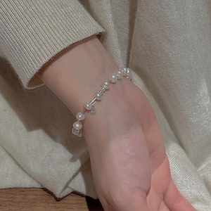 Elegant S925 sterling silver pearl bracelet with metal spacers shown on a wrist