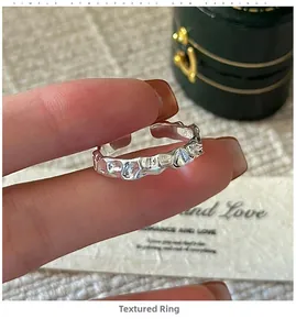 Close-up of S925 sterling silver ring featuring a vintage wavy textured surface design