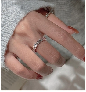 Close-up of S925 sterling silver ring with unique irregular lava texture on finger