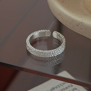 S925 sterling silver open ring with vintage hammered texture on a glass surface