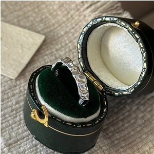 Detail of S925 sterling silver ring with vintage hammered texture in green velvet box