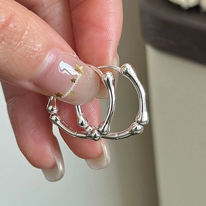 Polished S925 sterling silver bamboo style hoop earrings with a retro textured design