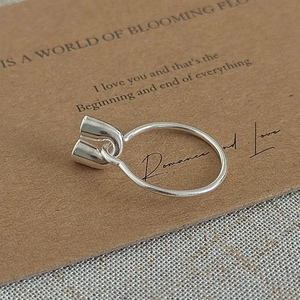 Minimalist S925 sterling silver U-shaped open ring shown on a vintage paper display card