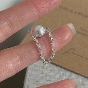 Minimalist S925 sterling silver chain ring with a frosted metallic bead on finger