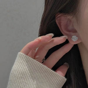 Minimalist S925 sterling silver rose stud earrings with detailed petal texture
