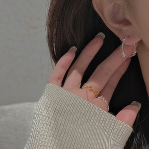 Minimalist S925 sterling silver bamboo style hoop earrings and dainty chain rings on model