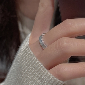 Close-up of a S925 sterling silver ring with pavé-set sparkling cubic zirconia stones
