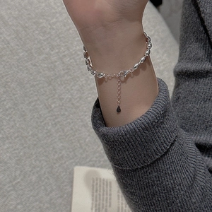 Close-up of S925 sterling silver bead bracelet with adjustable chain on person wrist
