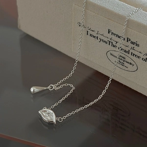 Elegant S925 sterling silver necklace with sparkling evil eye and polished teardrop pendants