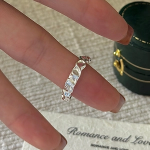 S925 sterling silver ring with vintage liquid metal texture worn on finger