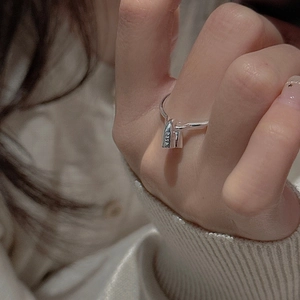 Detail of S925 sterling silver ring featuring a small lock pendant and S925 hallmark