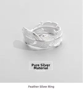 Detailed macro view of S925 sterling silver ring featuring realistic feather textures