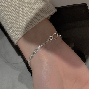 Detail of multi-layer S925 sterling silver chain bracelet with classic S-hook clasp