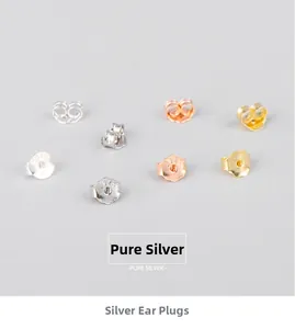 Macro detail of S925 sterling silver earring backs in silver, gold, and rose gold finishes