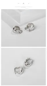 Vue macro de créoles polies en argent sterling S925 avec une texture épaisse et massive