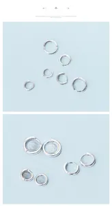 Gros plan sur des créoles en argent sterling S925 avec poinçon et finition miroir