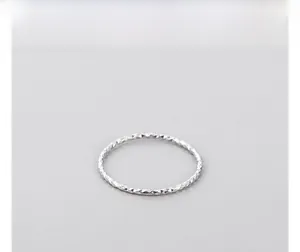Detailed macro view of S925 sterling silver ring with multi-faceted diamond cut texture