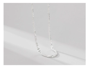 Macro view of sparkly S925 sterling silver chain with fine textured metallic glitter effect